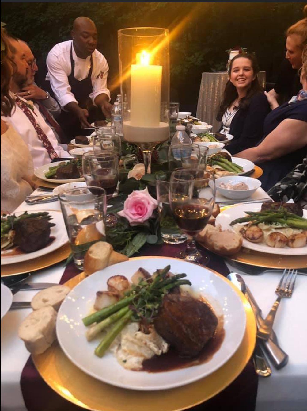 Chef Rico catering a candlelit dinner party